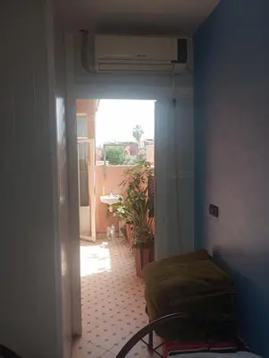 a room with a door leading to a room with a room at Appartment Dar Immi Medina Your Cozy Oasis in the Heart of Marrakech in Oulad Akkou