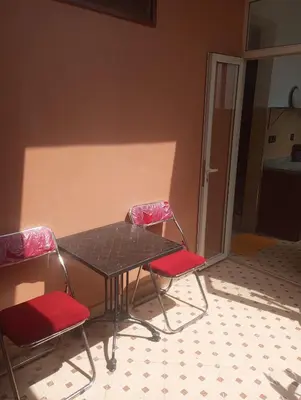 a table and two chairs in a room at Appartment Dar Immi Medina Your Cozy Oasis in the Heart of Marrakech in Oulad Akkou