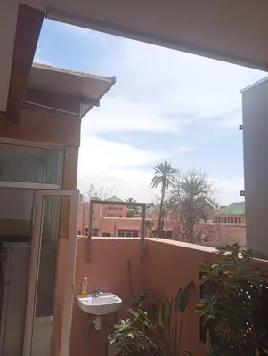 a bathroom with a sink on a balcony at Appartment Dar Immi Medina Your Cozy Oasis in the Heart of Marrakech in Oulad Akkou
