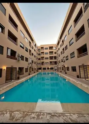 a large swimming pool in the middle of a building at La Joie de Vivre in Oulad Akkou