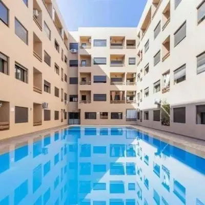 a large swimming pool in the middle of a building at La Joie de Vivre in Oulad Akkou