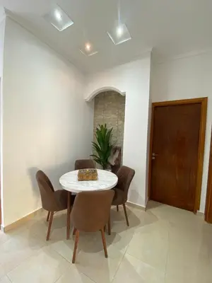 a dining room with a table and chairs at Unique et strategique in Meknès