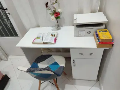 a white desk with a printer and a chair at Maison avec piscine in Oulad Akkou