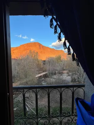 a view of ayers rock from a window at Kasbah Ait Marghad in Aït Ougliff