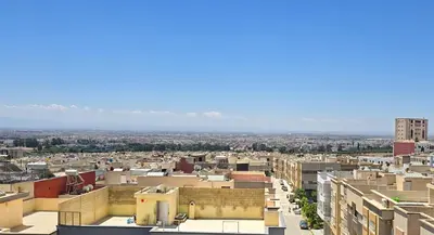 an aerial view of a city with buildings at Fes Serenity - Appartement Suites Medina in Fès