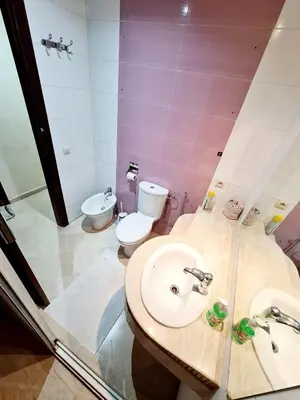 a bathroom with a sink and a toilet at Prestigia Fes Residence - Luxury Stay in Fès