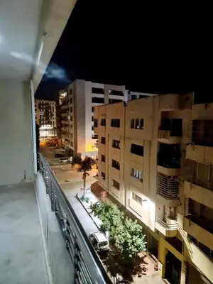 a view of a city at night with buildings at Prestigia Fes Residence - Luxury Stay in Fès