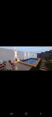 a picture of a swimming pool in a house at فيلا فاخرة in Imouzzer Kandar