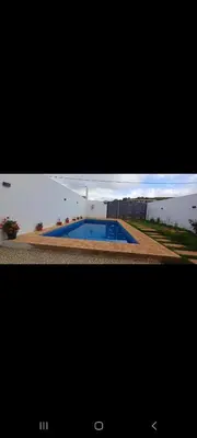 a picture of a house with a swimming pool at فيلا فاخرة in Imouzzer Kandar
