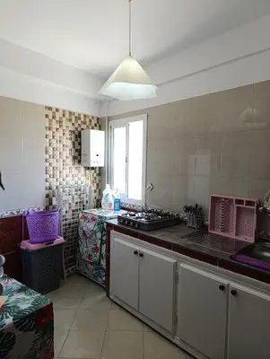 a kitchen with a sink and a counter top at Appartement martil in Oulad Akkou