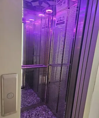 a shower with purple lights in a room at Chaker's Luxury Apartment Fez in Fès