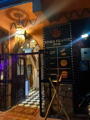 a restaurant with a sign that reads edible heritage box at Auberge Etoile Filante d Or Ait Ben Haddou in Aït Ben Haddou