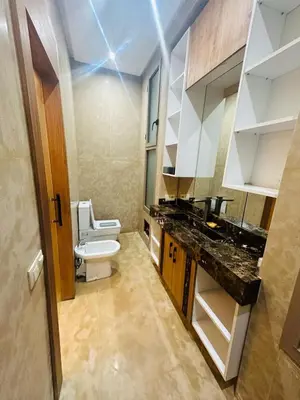 a bathroom with a toilet and a sink at Villa Paradise in Ahnaou