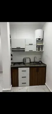 a kitchen with a sink and a counter top at Hatim bien-être in Oulad Akkou