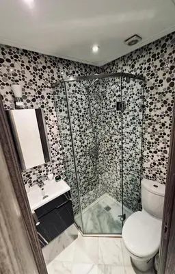 a bathroom with a shower and a toilet and a sink at Cozy apart in the heart of fez in Fès