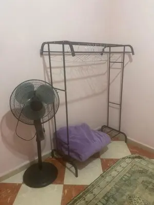 a room with a fan and a pillow on the floor at Residence meknes in Meknès