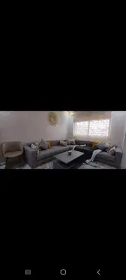 a living room with couches and a window at Villa de luxe in Imouzzer Kandar