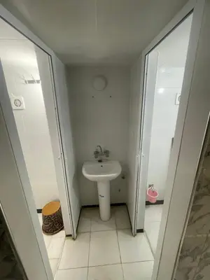 a small bathroom with a sink and a toilet at منزل العمراني in Oulad Akkou