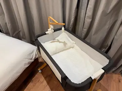a small hospital bed in a room with curtains at Suite Bahiya 21 in Fès