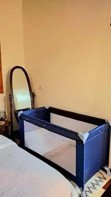 a blue crib in a room with a bed at Charming Villa with Pool in Amekhlig
