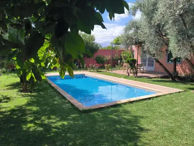 a swimming pool in the yard of a house at Charming Villa with Pool in Amekhlig