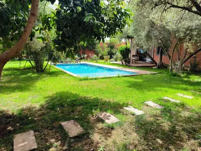 a swimming pool in the yard of a house at Charming Villa with Pool in Amekhlig