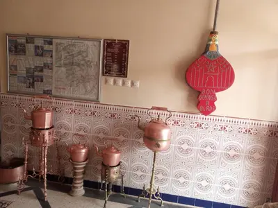 a room with a wall with red and white tiles at hotel boutaghrar in Bou Tharar