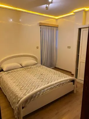 a bedroom with a bed in a room at Appartement spacieux in Oulad Akkou