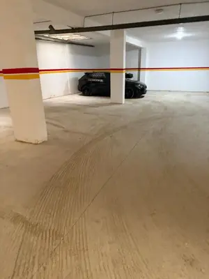an empty parking garage with two cars parked in it at Mehdia plage apparemment in Oulad Akkou