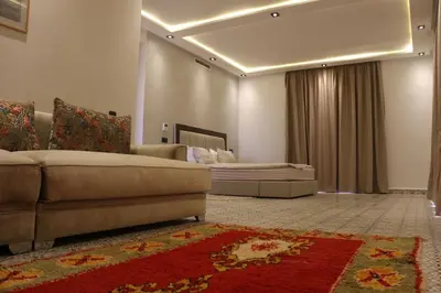 a living room with a couch and a bed at Villa Yassin Private Pool and Terrace in Marrakech