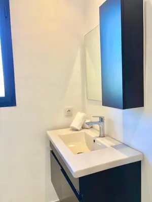 a bathroom with a sink and a mirror at Villa Elysia in Chaibate