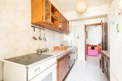 a kitchen with a sink and a counter top at Bel appartement in Oulad Akkou