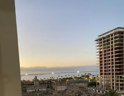 a view of a city with a tall building at Bel appartement in Oulad Akkou