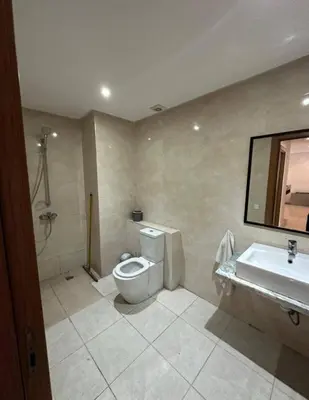 a bathroom with a toilet and a sink at Ismail in Oulad Akkou