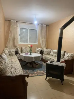 a living room with a couch and a table at Appartement juste pour les familles in Ifrane