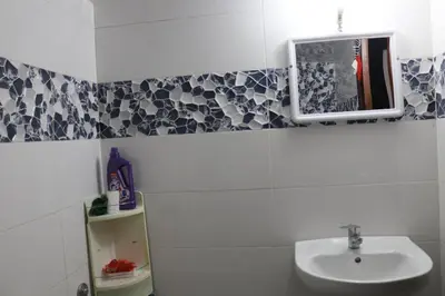 a bathroom with a sink and a mirror at Appartement juste pour les familles in Ifrane