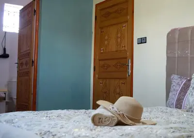 a hat sitting on top of a bed at berber discovery land