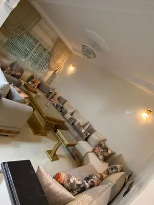 an overhead view of a living room with couches at Family Apartment in City Centre in Douar Oulad Mhammed