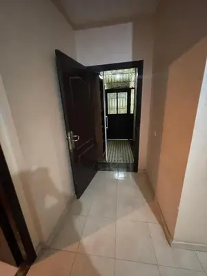 a hallway with a door leading to a room at Rayhana in Oulad Akkou