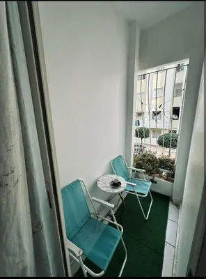 two chairs and a table in a room with a window at Marhaba in Fès