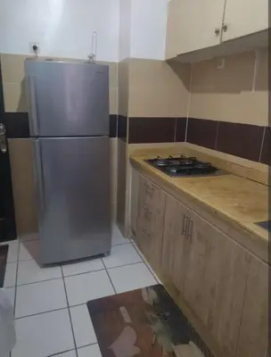 a kitchen with a refrigerator and a stove in it at Marhaba in Fès