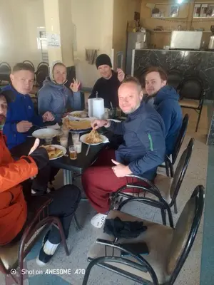 a group of people sitting at a table eating food at Rani hani chez ali in Tinerhir