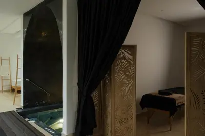a room with a fireplace and a room with a curtain at Marilah in Marrakech