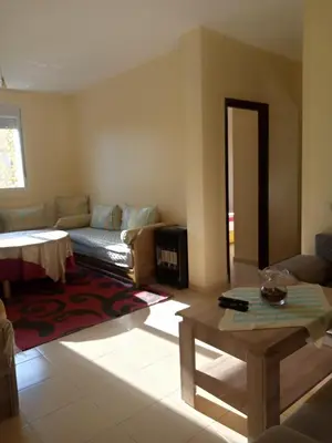 a living room with a couch and a table at Saloumi Appartment in Ifrane