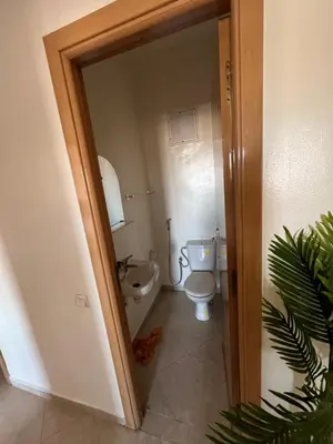 a small bathroom with a toilet and a sink at Smartkeys in Oulad Akkou
