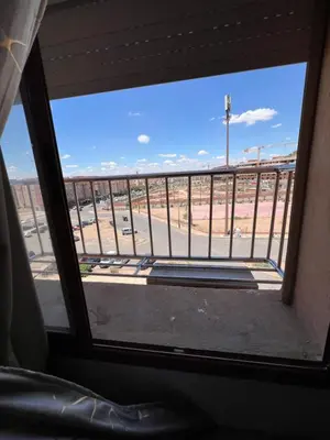 a view from a window of a parking lot at Smartkeys in Oulad Akkou