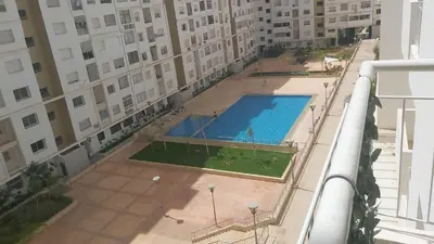 an overhead view of a swimming pool in a building at Appartement avec piscine in Oulad Akkou