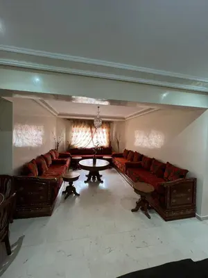 a large living room with couches and a table at appartement amine in Oulad Akkou
