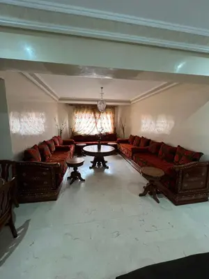 a large living room with couches and a table at appartement amine in Oulad Akkou