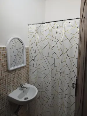 a bathroom with a sink and a mirror at MBS imo in Oulad Akkou